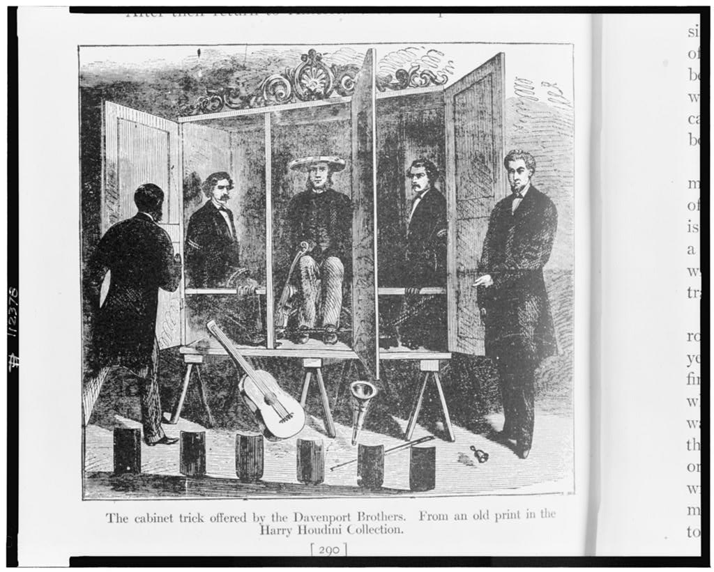 The Davenport Brothers and William Fay with their spirit cabinet. Source: The Library of Congress.